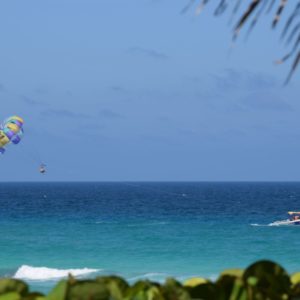 https://www.siam-experiences.com/wp-content/uploads/2021/07/beautiful-landscape-overlooking-sea-with-green-vegetation-speedboat-parachutes-1-300x300.jpg